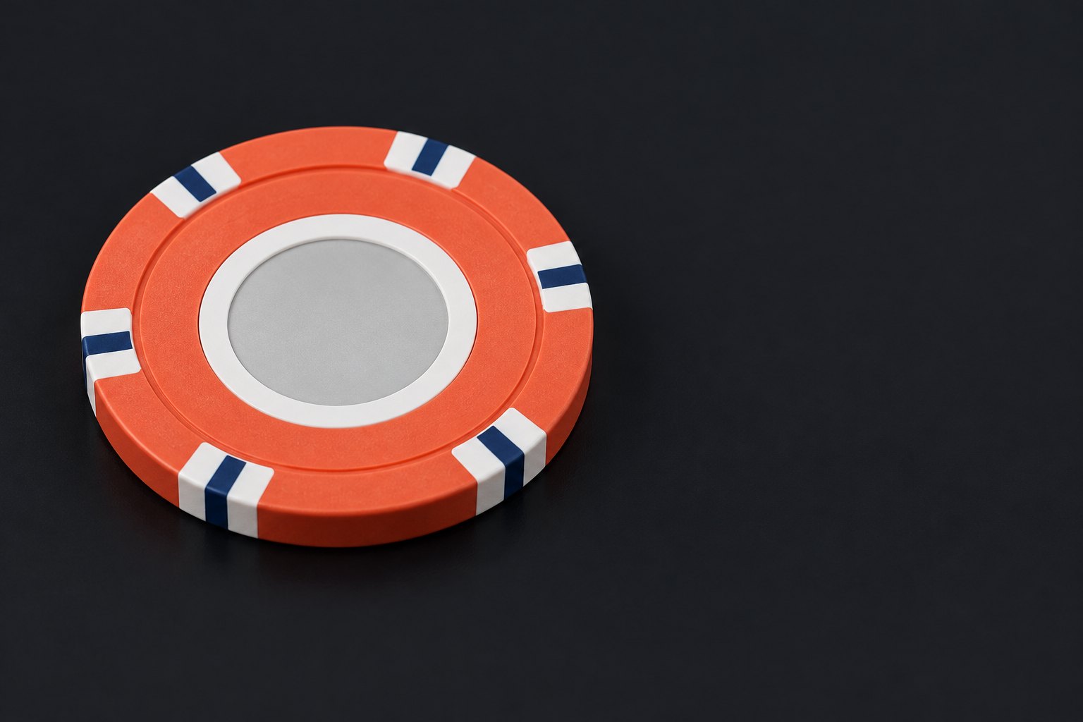 Round casino chip with edge spots and center label